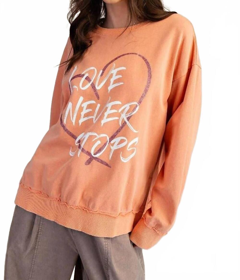 NEW EASEL love never stops sweatshirt in vintage coral